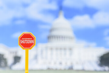Close-up of red “Government Shutdown” board at the U.S. Capitol. Symbol of budget freeze, federal service stoppage, political gridlock and looming economic damage after global leadership talks.