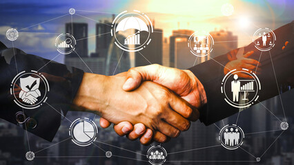 Business handshake with overlay of digital network and city skyline agreement deal