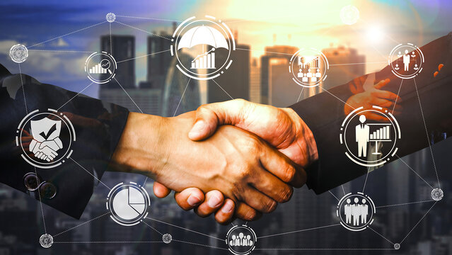 Business handshake with overlay of digital network and city skyline agreement deal - Powered by Adobe