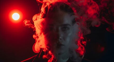 Mysterious woman emerges from vibrant red smoke under dramatic spotlight creating an intense, atmospheric, and captivating portrait experience