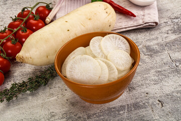 Sliced white daikon radish in the bowl