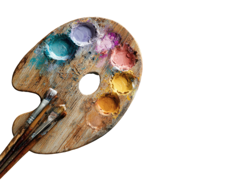Wooden palette with paints and brushes on black background