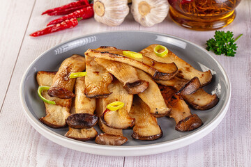 Roasted eringi mushrooms in the plate