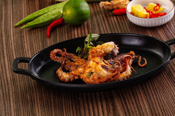 Gourmet grilled whole octopus served lime