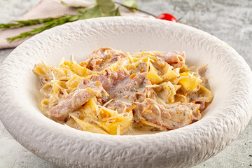 Italian pasta fettuccine with prosciutto