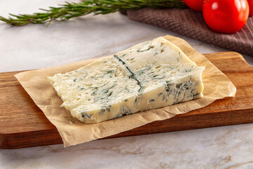 Tasty Italian gorgonzola cheese over board