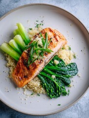 Grilled Salmon with Quinoa and Fresh Vegetables on a Plate