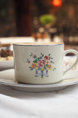 Beautiful floral tea cup on a table setting