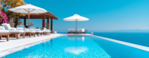 Fototapeta premium A serene infinity pool overlooking the ocean, surrounded by palm trees and sun loungers, perfect for relaxation and luxury vacations in a beautiful sunny destination.