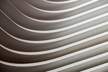 Part view of a built construction with curves, like abstract graphic background in black and white shapes