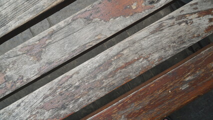 Close-up of weathered wooden bench slats