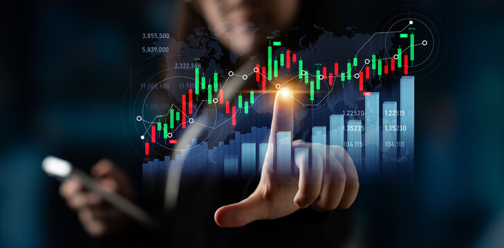 A business professional interacts with digital stock market data, illustrating financial growth and analysis in a contemporary office setting. Scalp