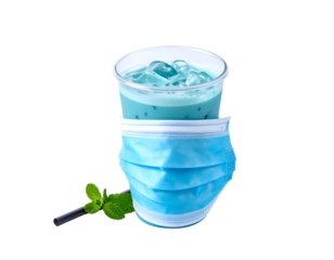 A refreshing blue beverage with ice cubes placed inside a transparent cup, partially covered by a disposable face mask and accompanied by mint leaves and a straw