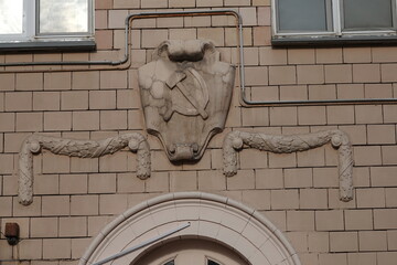 Hammer and sickle decoration on the facade of an apartment building built in 1958 in Moscow's Money Lane