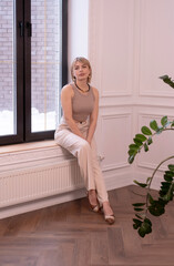 Vertical. happy, smiling, confident, professional businesswoman in business suit, thinking about success and dreaming of new goal.