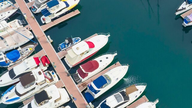 Aerial view of luxury yachts docked in a marina