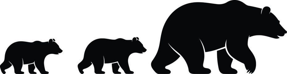 Silhouette of a large bear with two smaller cubs walking in a line