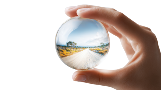 Beautiful landscape viewed through crystal glass ball symbolizing future vision inspiration and reflection concept of creativity and clarity on white background