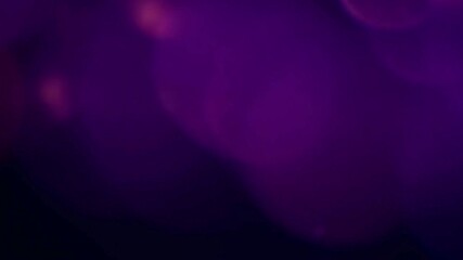 Dark purple abstract background with soft moving bokeh lights. Violet light leaks overlay for video editing and dreamy transitions. - Powered by Adobe