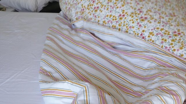 Making a cozy bed with fresh linens