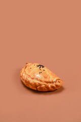 Stuffed Pastry Close-Up on Solid Background