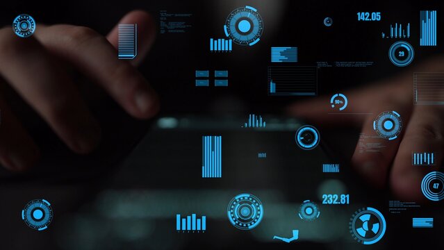 A close-up view of hands engaging with a digital interface that showcases interactive charts and graphs representing data insights in a dark environment. Xenic