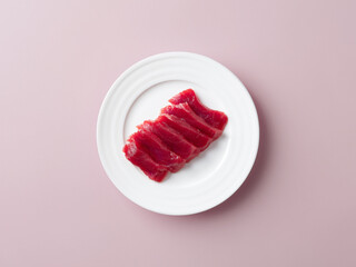 Fresh sliced raw tuna on plate