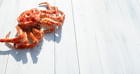 King crab on white wooden background