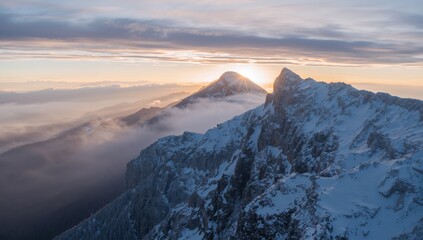 Majestic Mountain Peaks at Dawn SnowCapped Summits Catching the First Lights Glow.