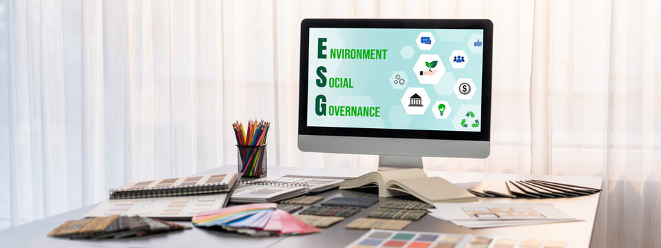 Interior designer workspace table and architecture software on laptop screen with mood board materials and colorful swatch color for color selection. Modern interior design office. Insight - Powered by Adobe