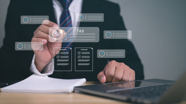 Tax report concept, Businessman interacts with a holographic interface, managing digital documents and checklists related to tax and financial compliance.