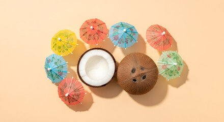 Halved coconut surrounded by colorful cocktail umbrellas creating a summery vibe