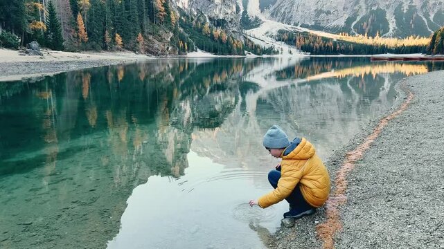 Exploring the clear waters of Lago di Bries while enjoying nature's beauty in Italy