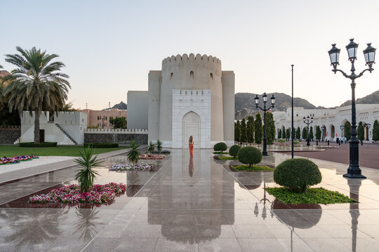 Woman exploring al alam palace area, muscat, oman