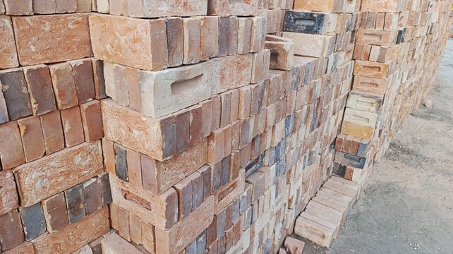 Stack of foundation stones and refractory fire bricks for industrial and building applications.
