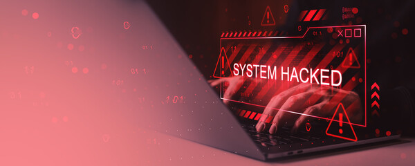 Cybersecurity alert with red system hacked warning sign over laptop screen and hands, symbolizing online virus threat and data breach concept.