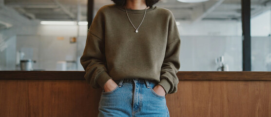 Relaxed Individuality in Modern Space: A person embodies a sense of casual elegance in a contemporary setting, exuding an air of understated confidence and individuality. 