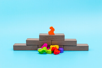 The winner stands on a pedestal above the defeated competitors and enemies, concept