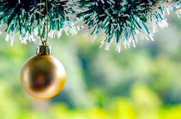 Golden Christmas ball with customizable space for text or wishes. Christmas celebration concept.