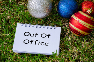 Out of Office Top view of Out of Office text on with Christmas decoration background.