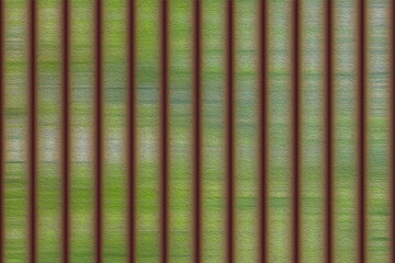 rustic vertical stripe pattern with moss green and rusty brown texture. grunge metal surface with heavy grain noise effect.
