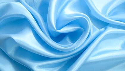 Fototapeta premium Soft, sky-blue fabric drapes gracefully, forming elegant swirls and folds, catching light to create gentle highlights
