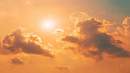 Obraz premium Serene Sunset Over Soft Clouds Illuminated by Warm Sunlight Creating a Tranquil Atmosphere in a Beautiful Evening Sky