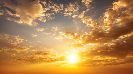 Obraz premium Beautiful Sunrise Over the Horizon with Vibrant Orange and Yellow Hues Illuminating the Sky Filled with Soft, Fluffy Clouds and Gentle Light Rays