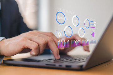 Close-up of male hands working on laptop keyboard in modern office. Businessman typing or browsing, symbolizing digital communication, remote work or online business.