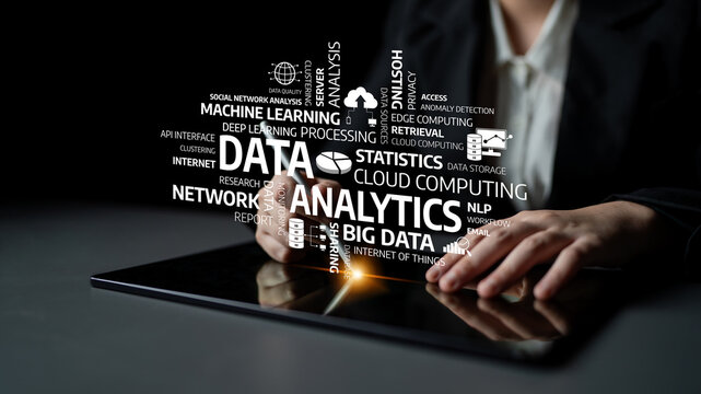 A business professional interacts with data analytics concepts on a tablet, showcasing modern technology role in extracting insights and innovative solutions. Tessel - Powered by Adobe