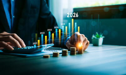Business growth and financial investment strategy concept with hand stacking coins and bar chart showing increasing profit,  revenue forecast from 2021 to 2026, symbolizing success, economic progress
