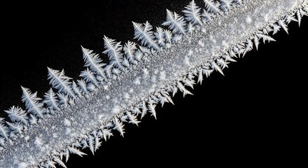 frosted icy texture with snowflakes formation isolated on black background