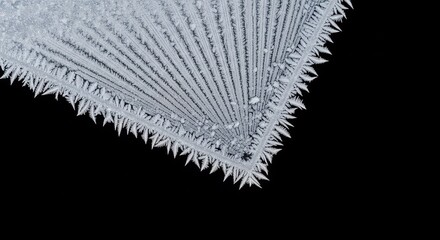 frosted icy texture with snowflakes formation isolated on black background