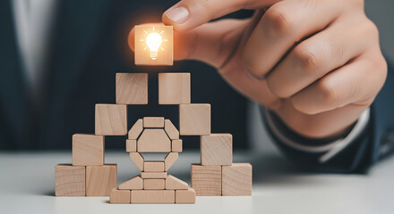 Innovative strategy idea with wooden blocks and shining lightbulb, building blocks for success, creative problem solving, business growth and planning concept